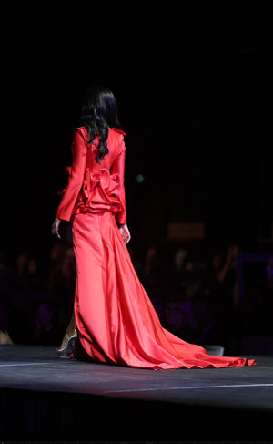 HOK House Of KLynn Couture Rich Satin Dramatic Red Luxury Ruffled Tuxedo Gown Open Back Flowing Train Evening Event Gala Vogue Runway Top Looks Lifestyle Holiday Party New Years Eve Birthday Red Carpet Style Inspiration Cover Model Designer Box Office Award Show Winner Nominees 