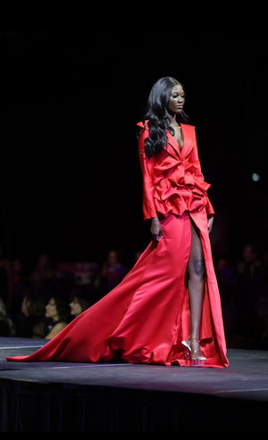 HOK House Of KLynn Couture Rich Satin Dramatic Red Luxury Ruffled Tuxedo Gown Open Back Flowing Train Evening Event Gala Vogue Runway Top Looks Lifestyle Holiday Party New Years Eve Birthday Red Carpet Style Inspiration Cover Model Designer Box Office Award Show Winner Nominees