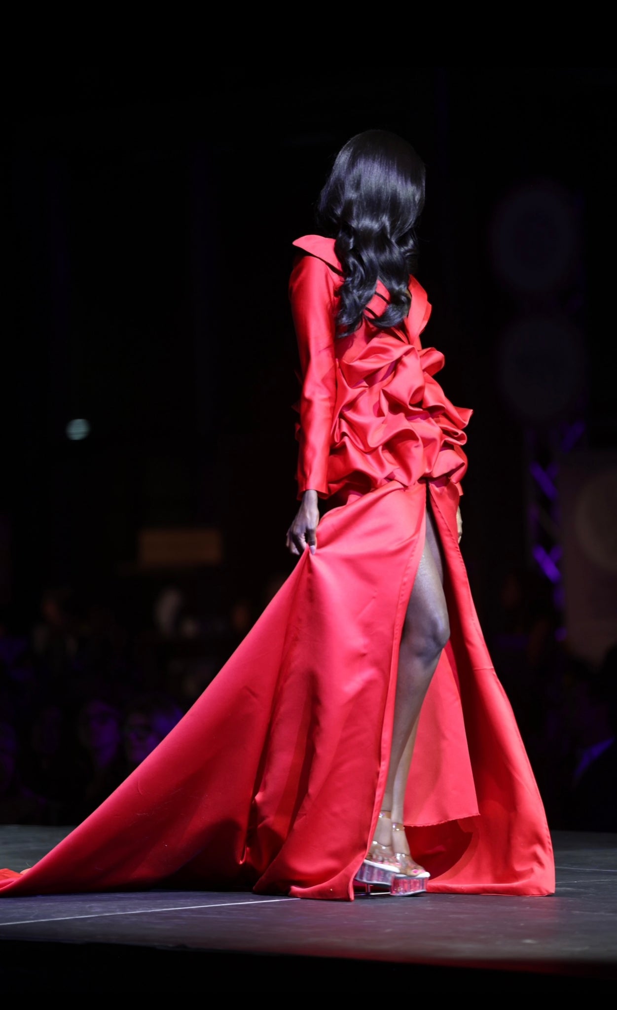HOK House Of KLynn Couture Rich Satin Dramatic Red Luxury Ruffled Tuxedo Gown Open Back Flowing Train Evening Event Gala Vogue Runway Top Looks Lifestyle Holiday Party New Years Eve Birthday Red Carpet Style Inspiration Cover Model Designer Box Office Award Show Winner Nominees